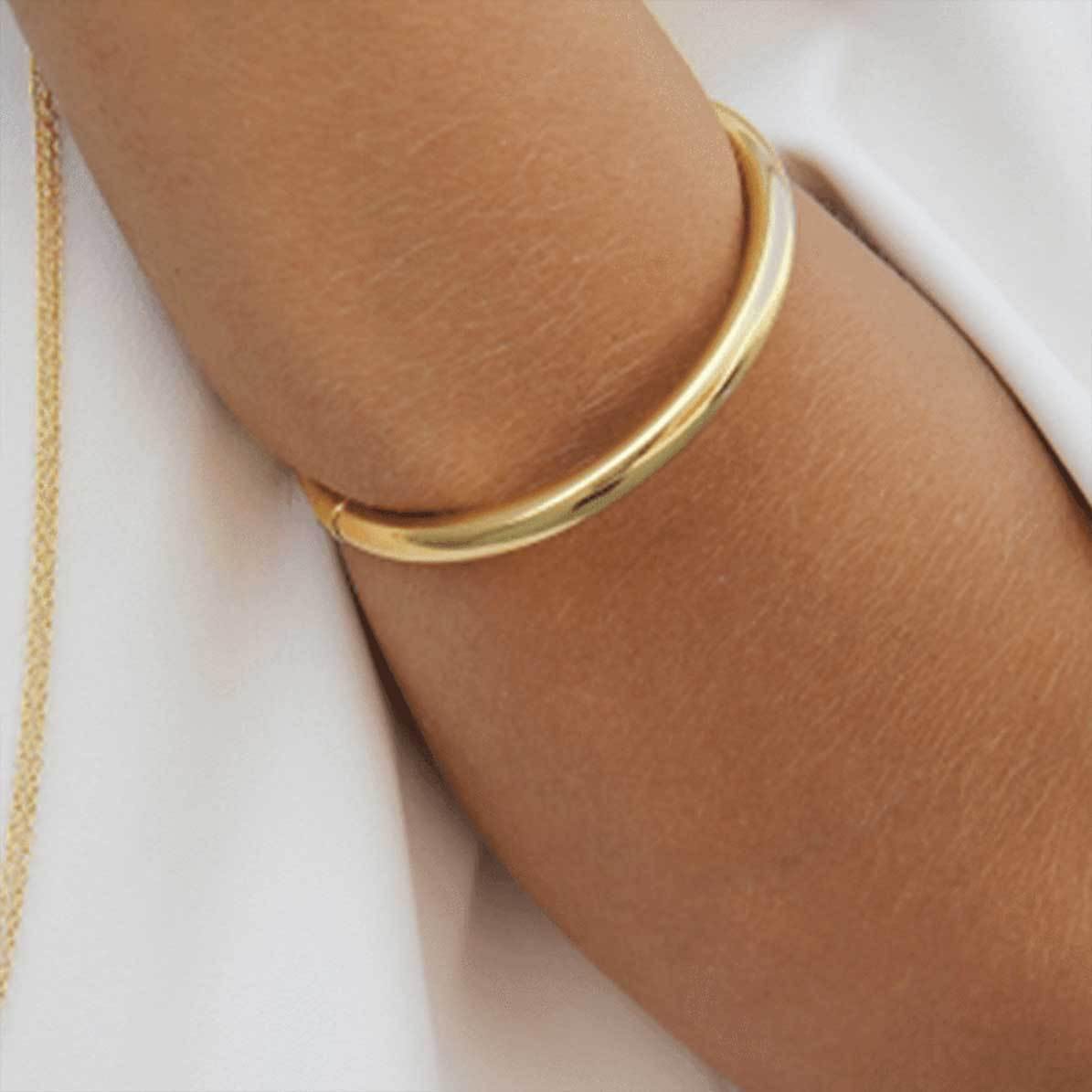 Model wearing 18k gold plated handmade bangle - Tanzire