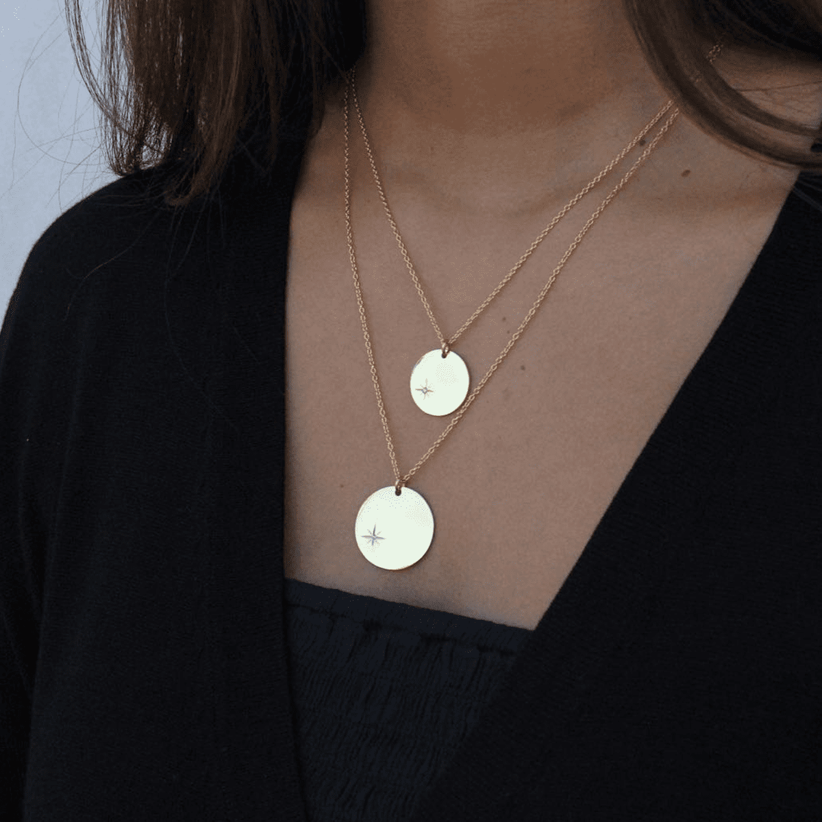Girl Layering Tanzire's 18k Gold-Plated Polar Star Big and Small Pendant Chains - Tanzire