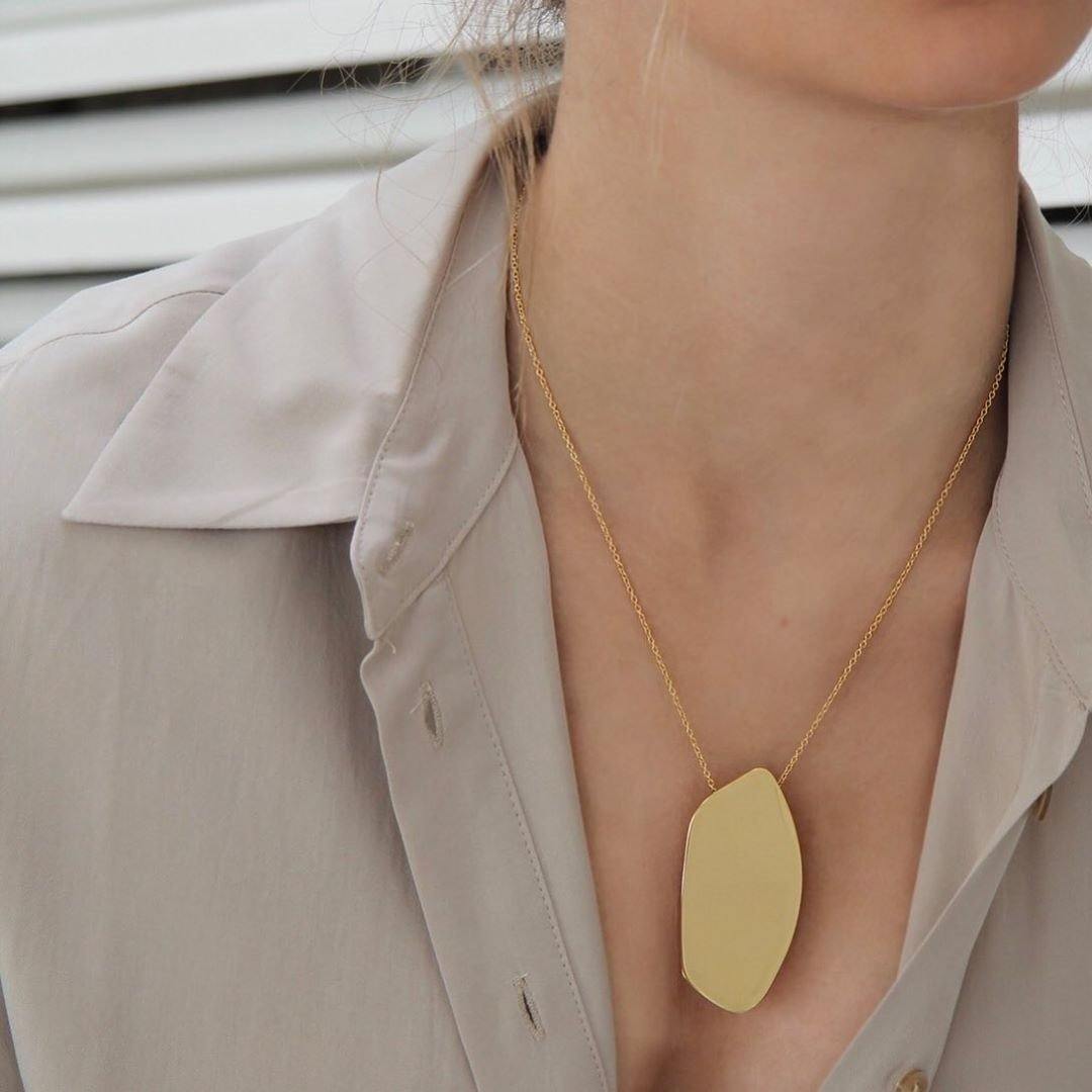 Model wearing Tanzire's asymmetric 18K Gold Plated Pendant Chain with a button-down shirt