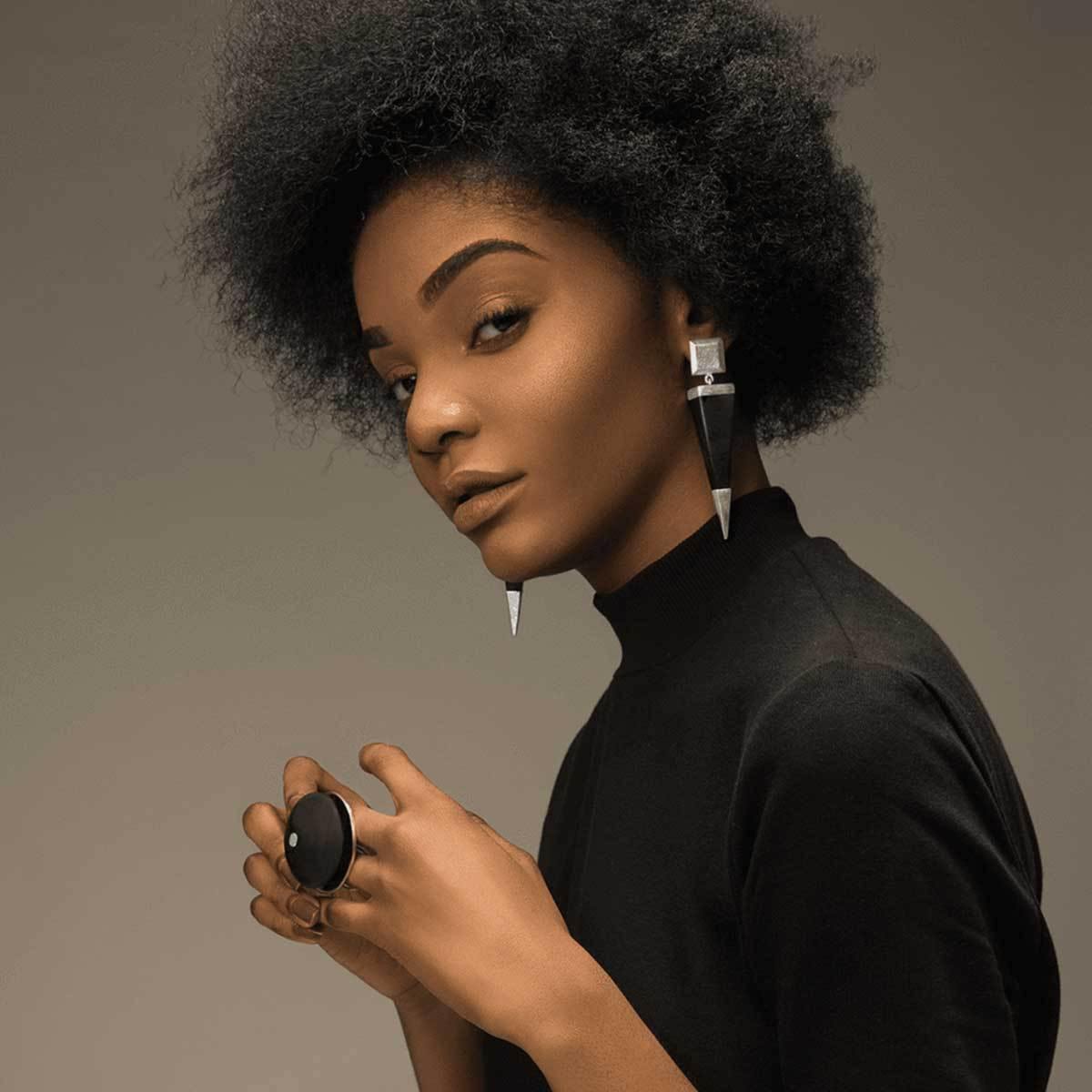 Fashion Model wearing 925 Sterling Silver And Ebony Wood Pyramid Earrings - Tanzire Store