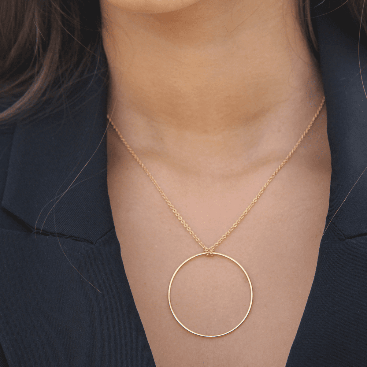 Model wearing handmade 18k gold plated circular pendant chain depicting exact size and appearance - Tanzire