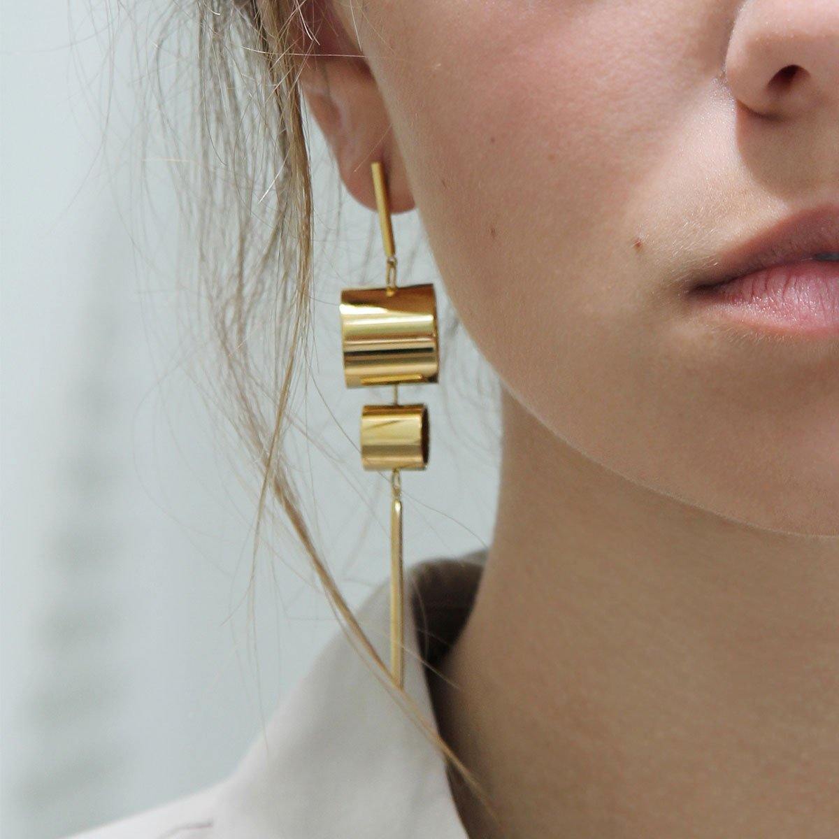 Model Wearing Tanzire's Subtle Statement-making 18k Gold Plated Dangle Earrings