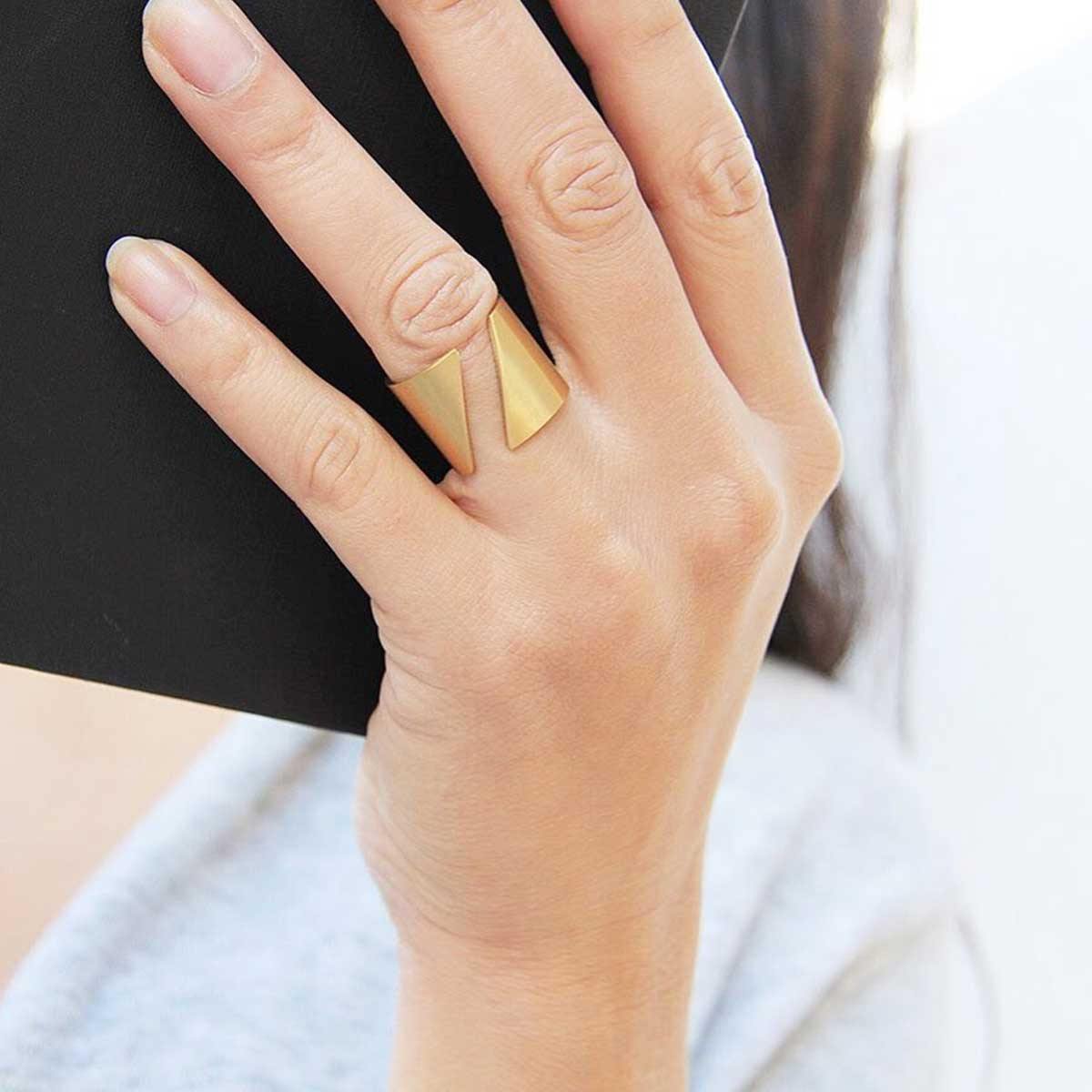 Girl wearing 18k Gold Plated Handmade Diagonal Ring As She Reads A Book